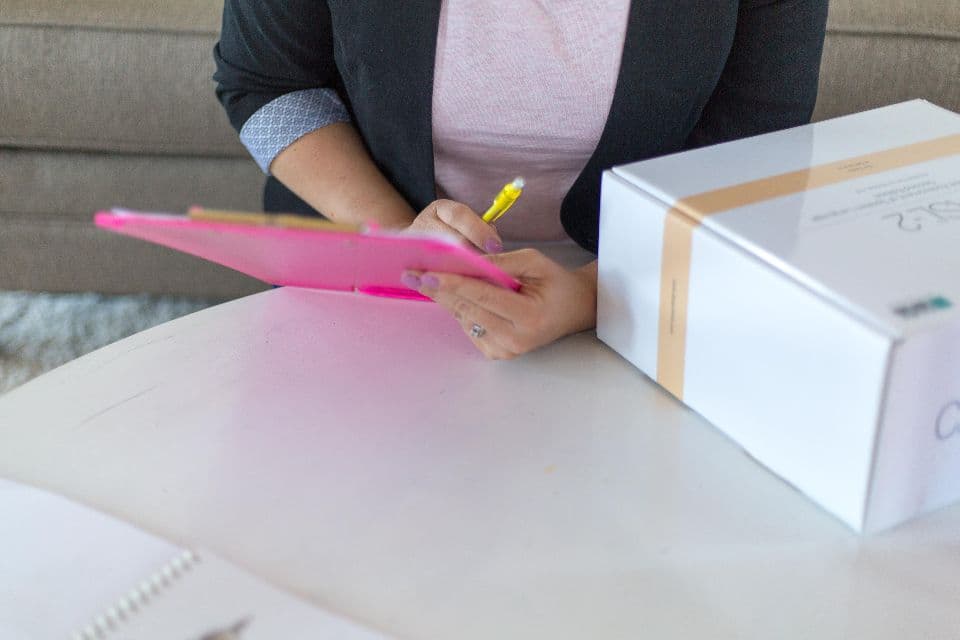 Someone packing an order at a desk